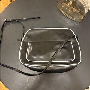 MGXX black crossbody bag with white piping detail